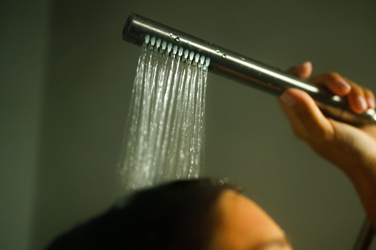 A hotel shower head: the shower is the largest single source of water use in a room